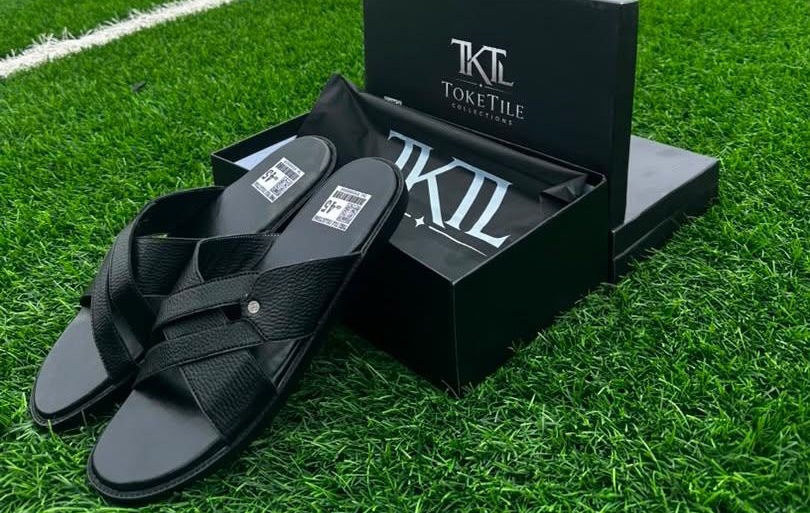 TokeTile Cut black leather cross-strap slippers with branded box